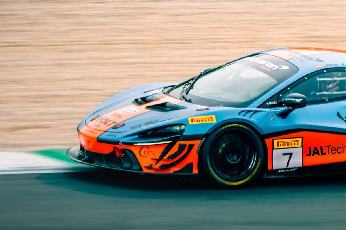 Race car with JALTech sponsorship livery on track